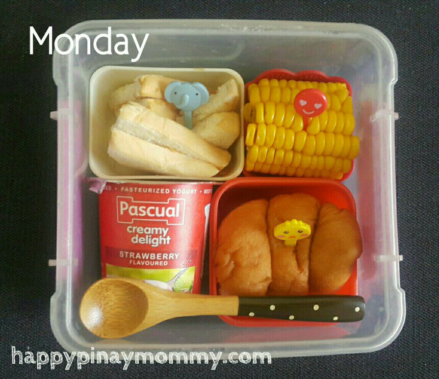 Monday school snack baon ideas: peanut butter mini sandwiches, strawberry yogurt, twisty bread, and corn on the cob.