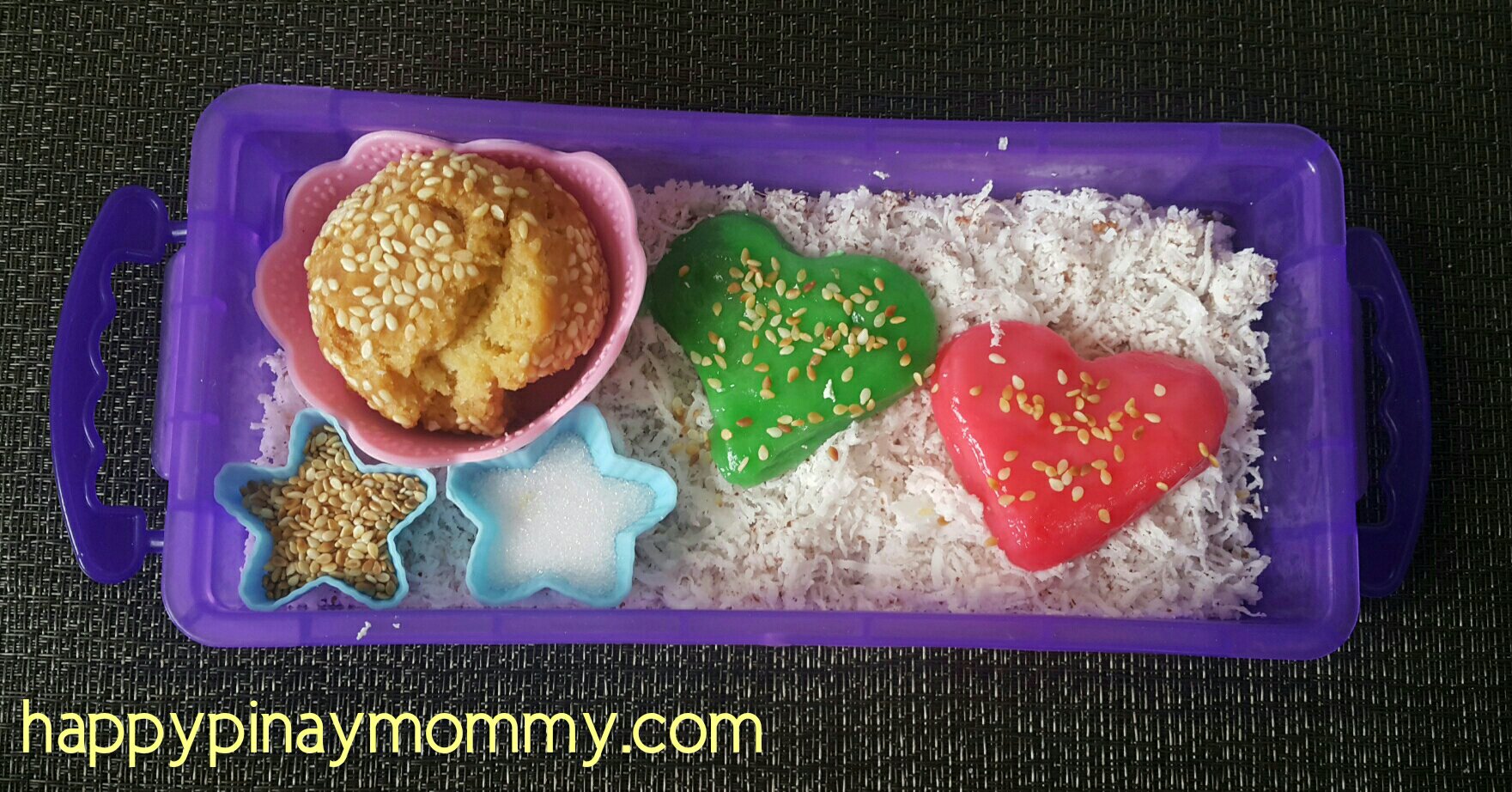 Colorful homemade palitaw on a bed of niyog, and extra binangkal bread